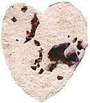hearts made from recycled paper with rose petals, leaves, and glitter